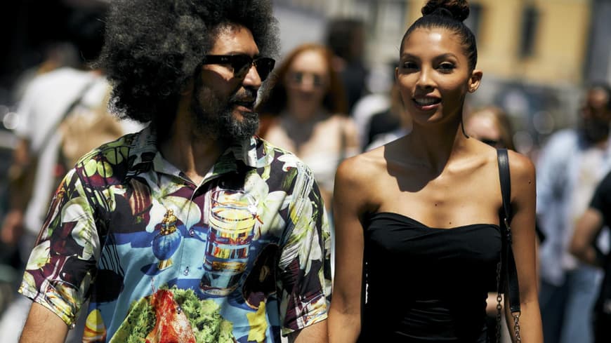Paar Händchen haltend Mailand Fashion Week Streetstyle