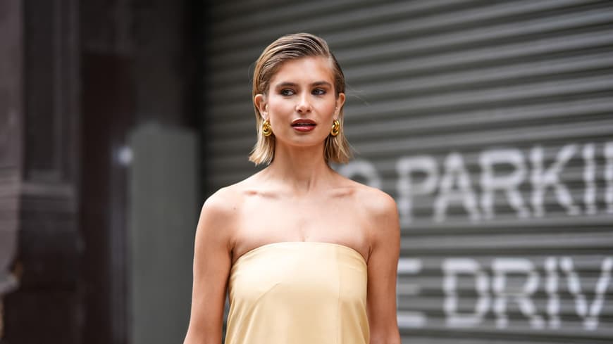 Xenia Adonts im gelben Kleid