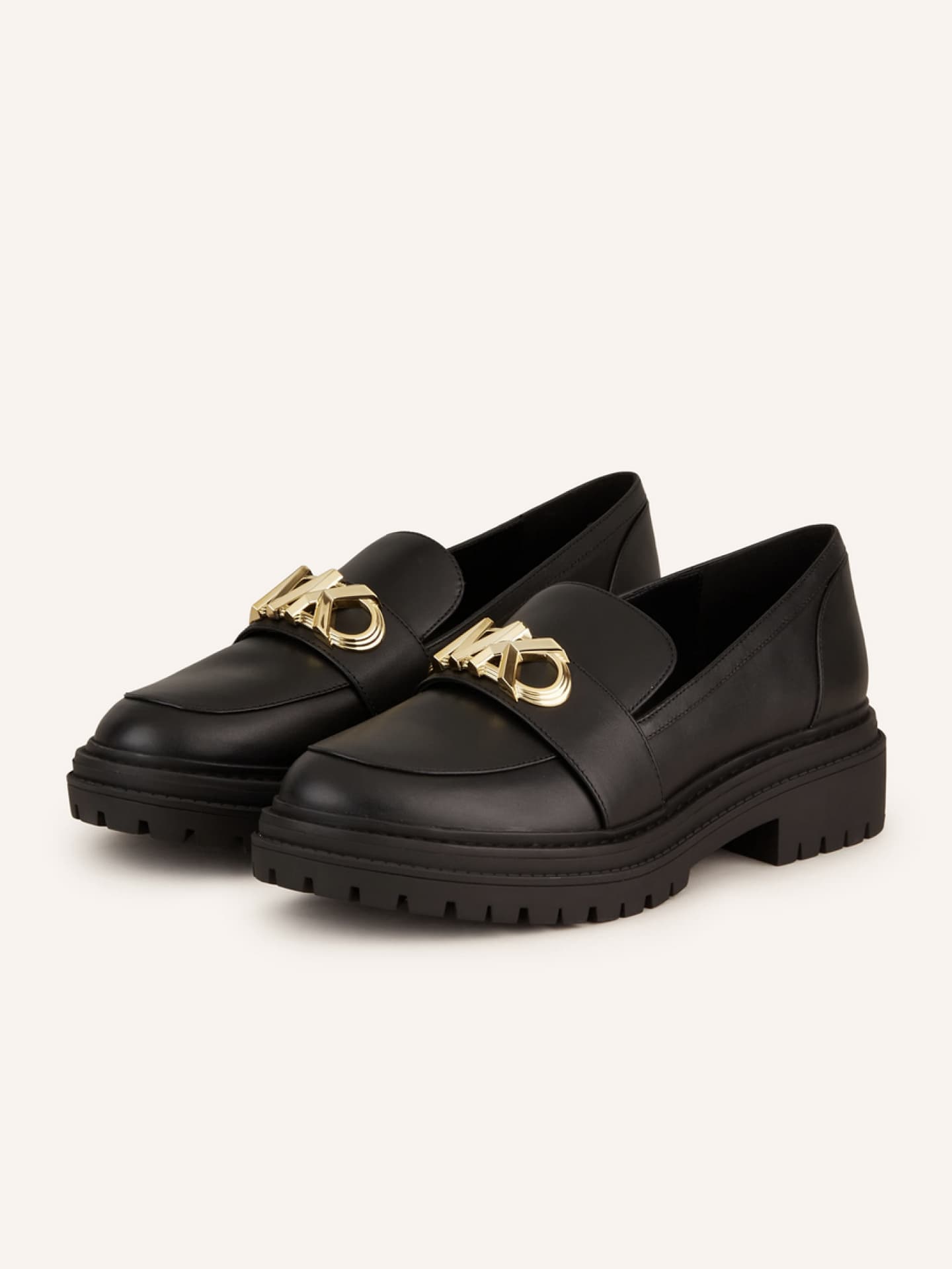 Schwarze Loafer von Michael Kors mit goldfarbener Logo-Applikation